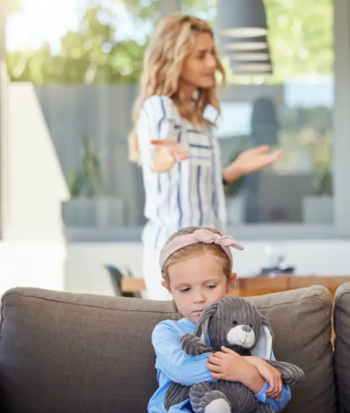 mom and daughter on a sofa