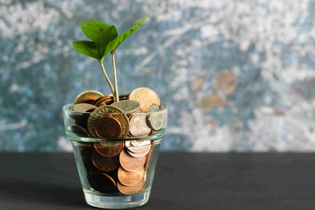 Money growing in a glass